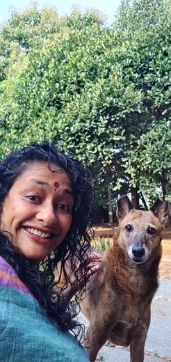 Close portrait of Sindhoor Pangal with a dog